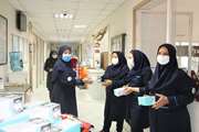 اهدای وسایل حفاظتی به مدافعان سلامت و بیماران به مناسبت هفته سلامت در مرکز طبی کودکان